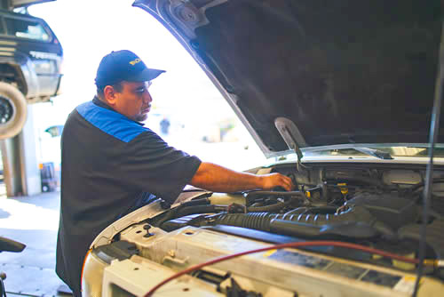 huntington beach auto repair - man working on a car